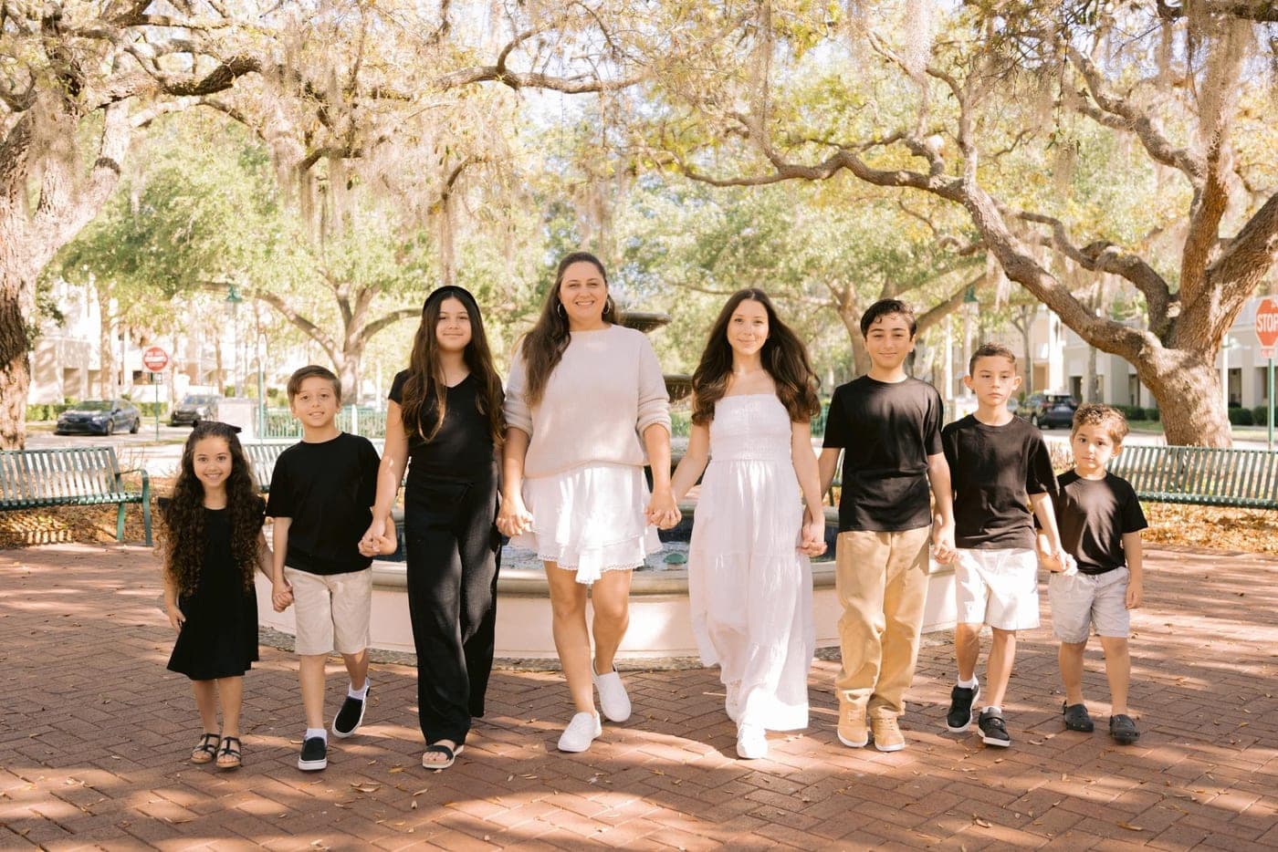 Katelyn, Ms. Goose, walking hand in hand with a flock of little ones